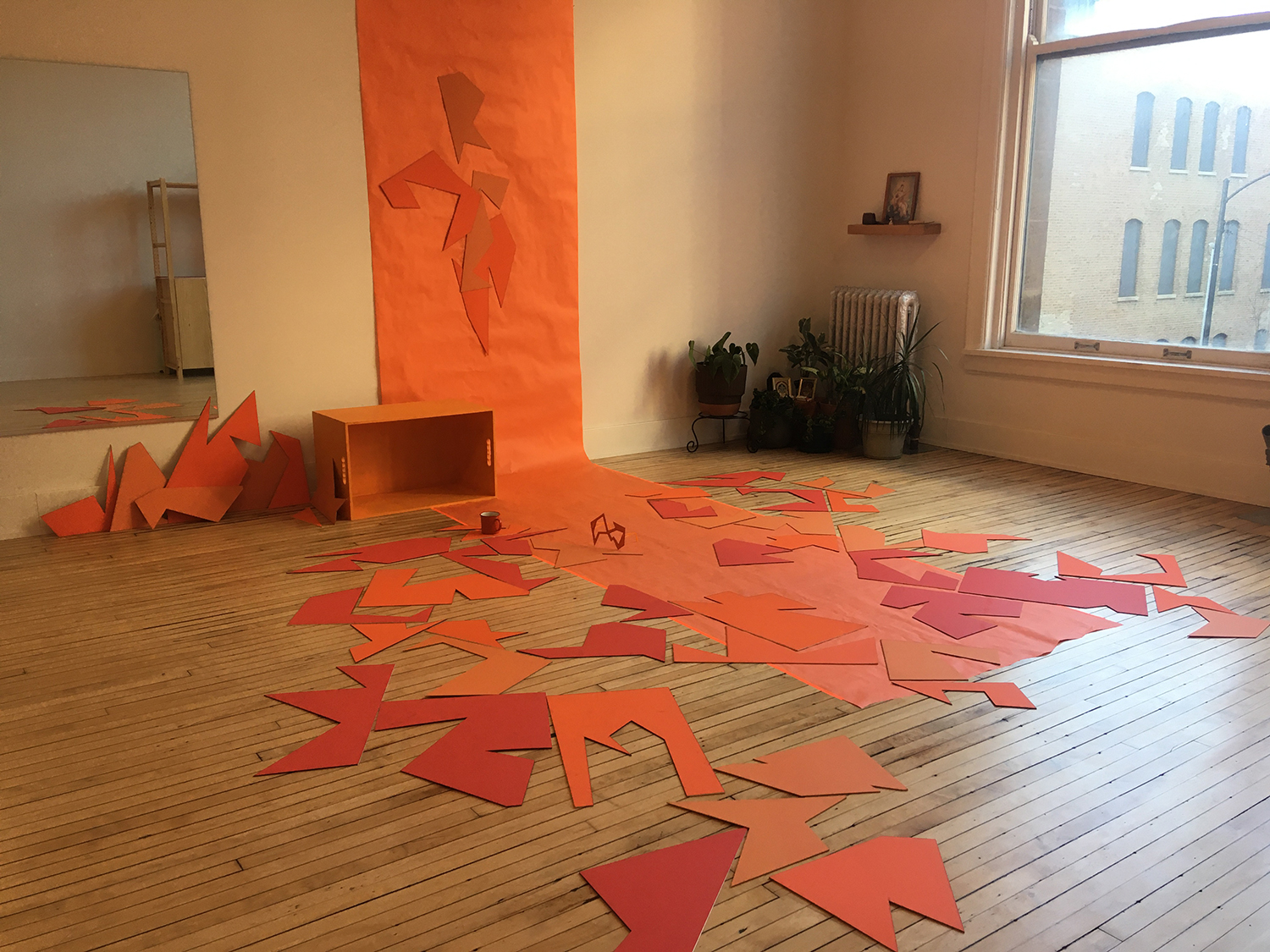 a paper and panel installation in a gallery.